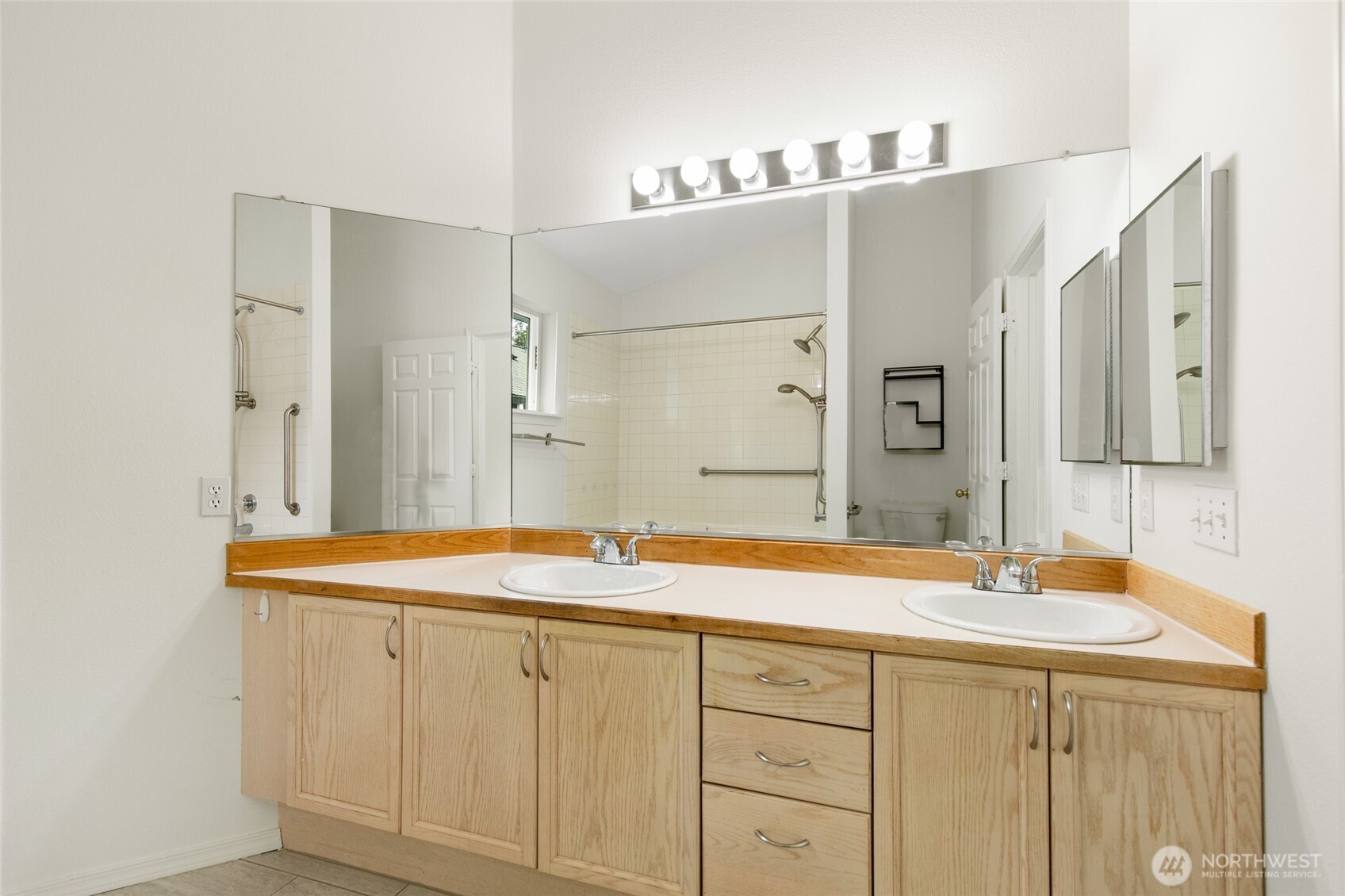 22619 4th Avenue West, Unit 3103 Bothell, WA 98021 - Photo 14 of 22 a bathroom with a sink and a mirror