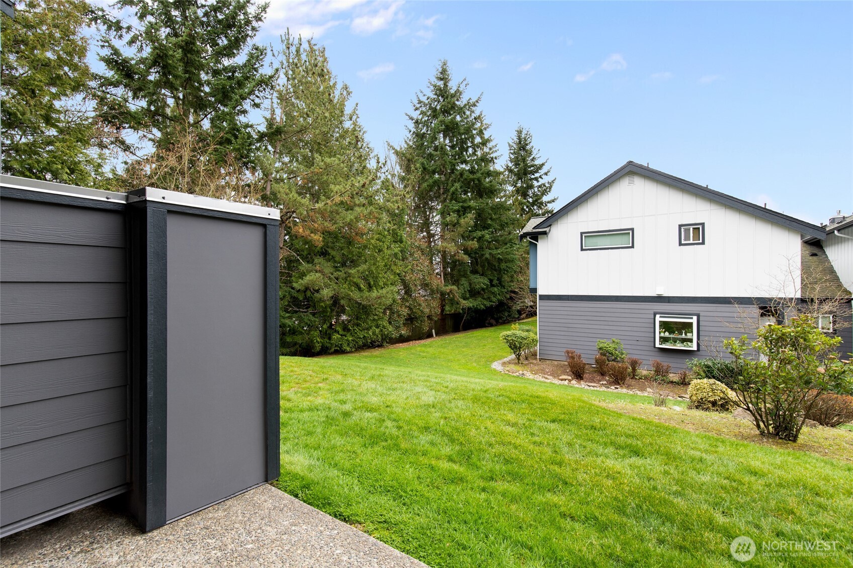 22619 4th Avenue West, Unit 3103 Bothell, WA 98021 - Photo 17 of 22 a view of a backyard with table and chairs and potted plants