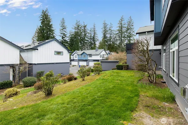 a view of a house with a yard and garden