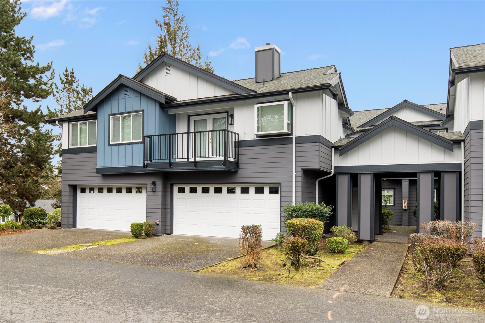 22619 4th Avenue West, Unit 3103 Bothell, WA 98021 - Photo 21 of 22 a front view of a house with a yard and garage