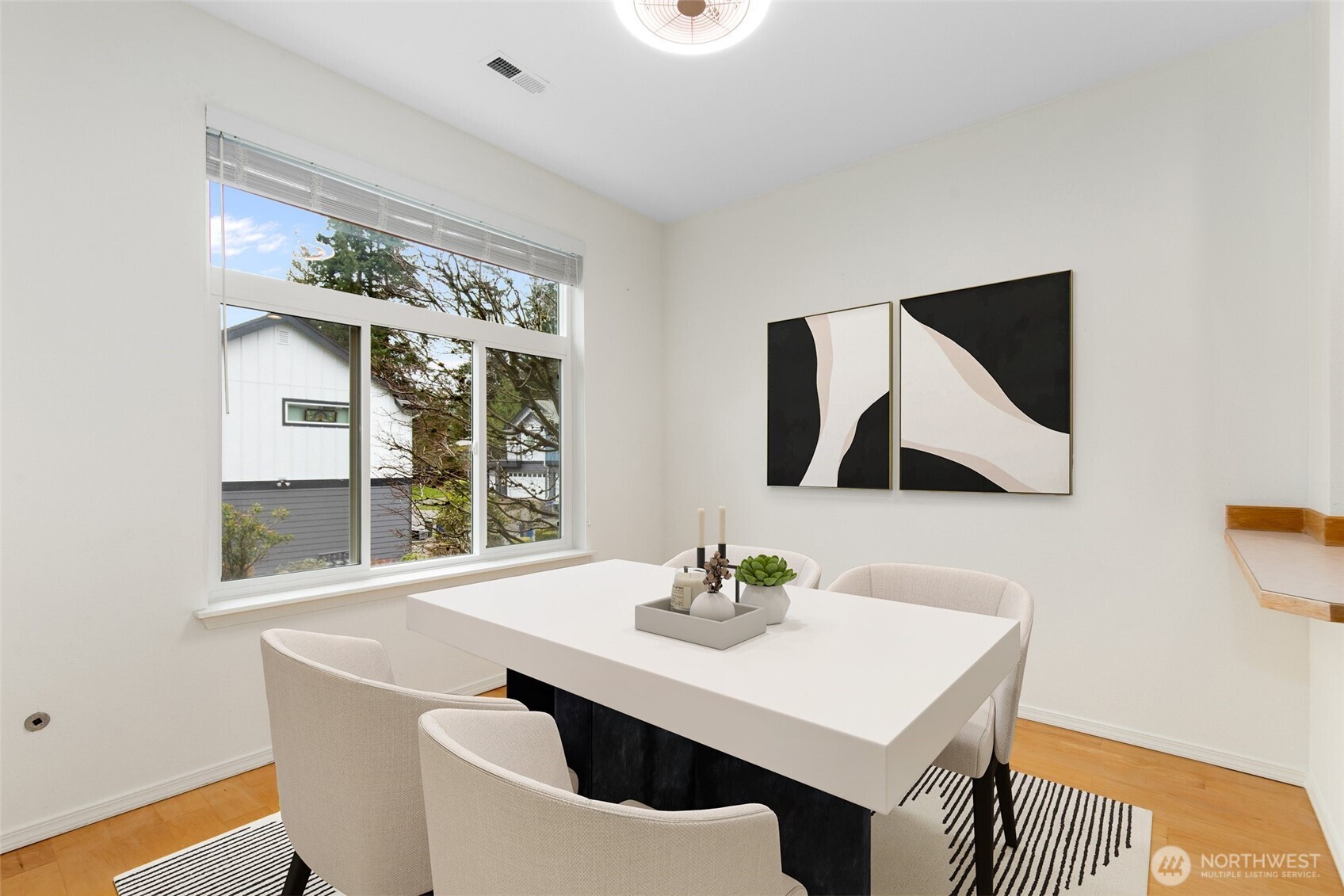22619 4th Avenue West, Unit 3103 Bothell, WA 98021 - Photo 3 of 22 a view of a dining room with furniture window and wooden floor