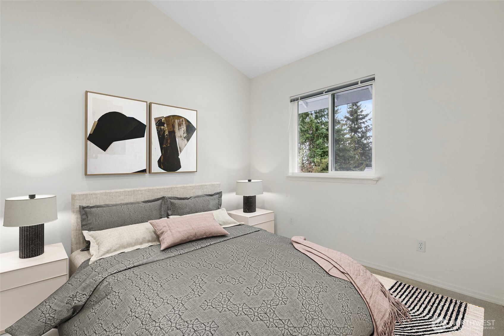 22619 4th Avenue West, Unit 3103 Bothell, WA 98021 - Photo 10 of 22 a bedroom with a bed and a painting on the wall