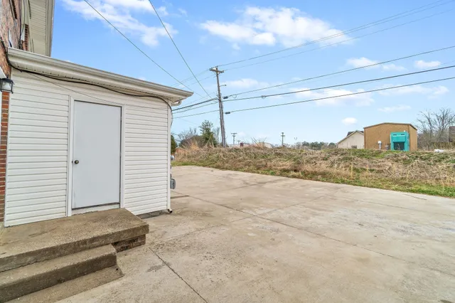 a view of a backyard of the house