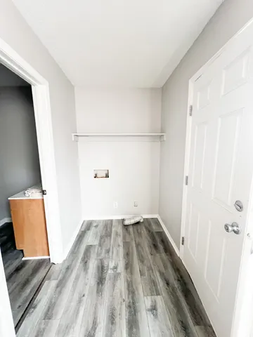 wooden floor in a hall with an entryway