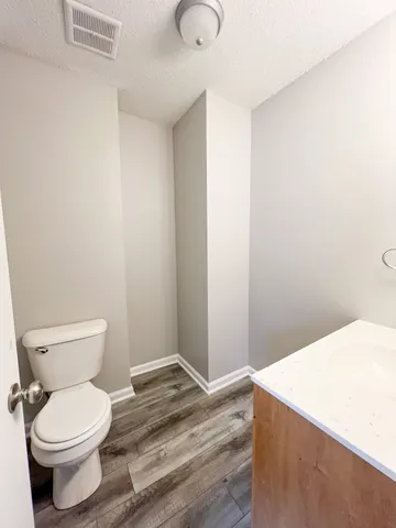 a bathroom with a toilet and a sink