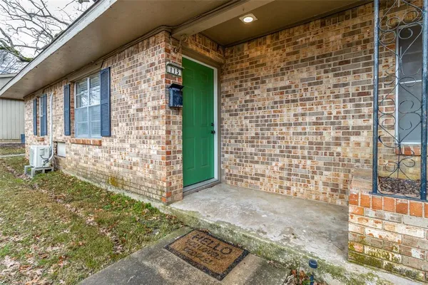 a view of front door of house with a outdoor space