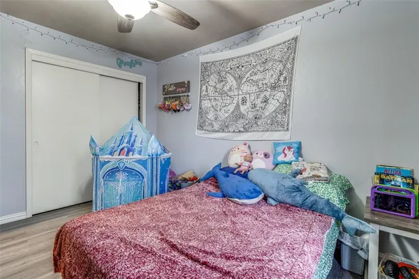 a bedroom with a bed and furniture