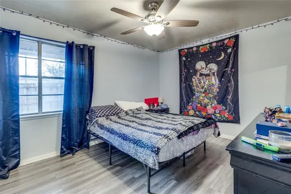 a bed room with a bed and a chandelier