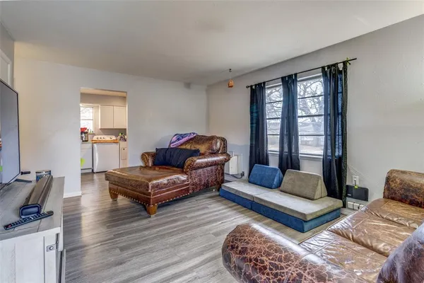 a living room with furniture and a window