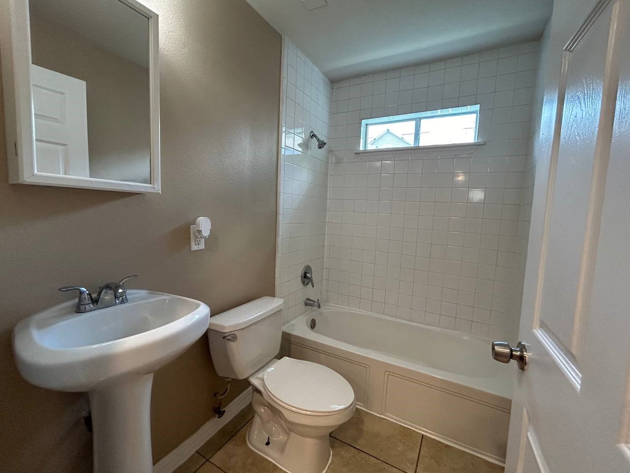 831 West 25th Street, Unit 7 Houston, TX 77008 - Photo 15 of 15 a bathroom with a sink toilet and shower