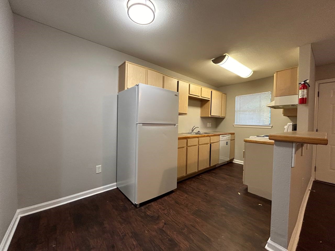 831 West 25th Street, Unit 7 Houston, TX 77008 - Photo 4 of 15 a kitchen with white cabinets and white appliances