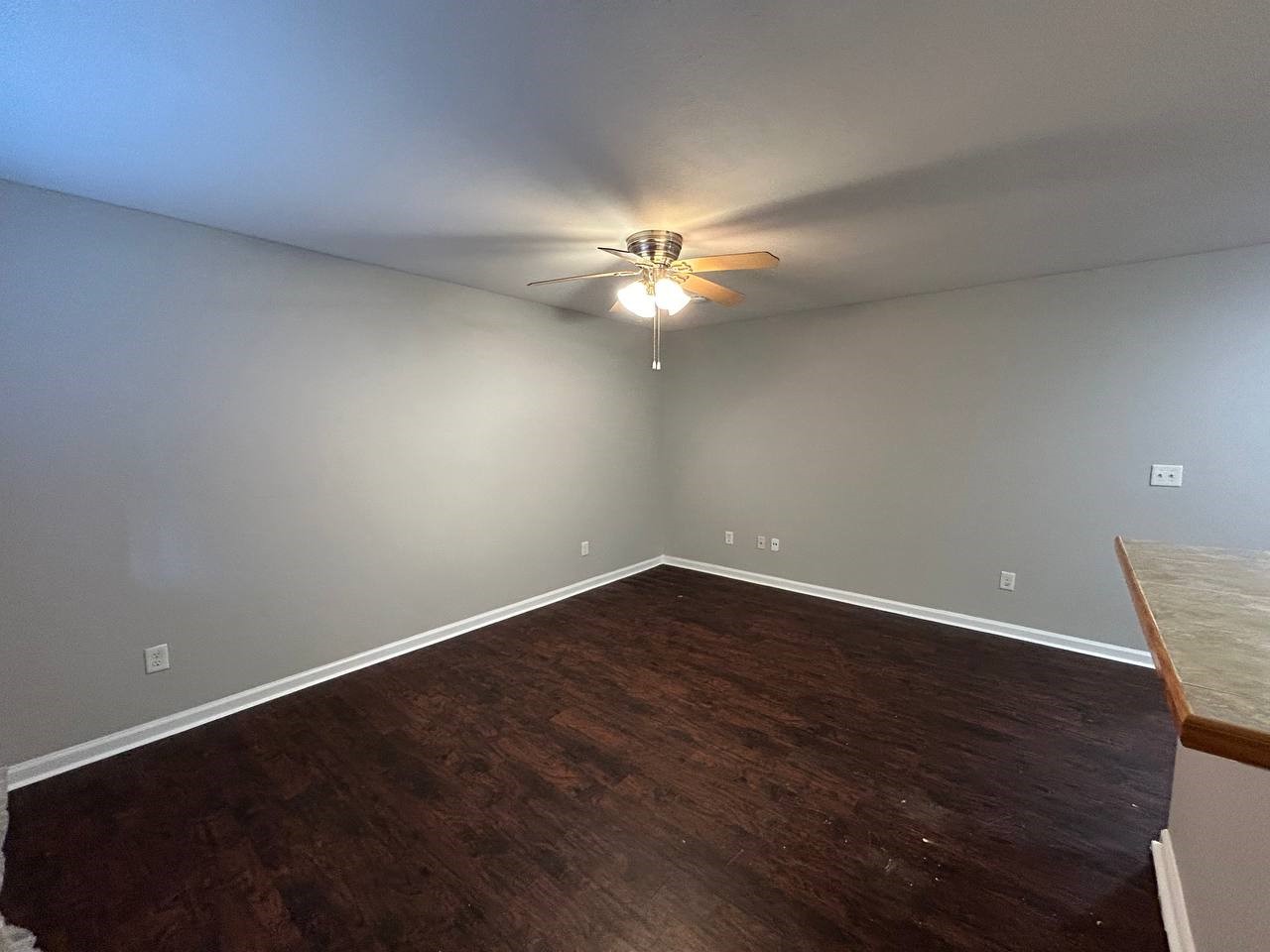 831 West 25th Street, Unit 7 Houston, TX 77008 - Photo 6 of 15 an empty room with wooden floor and fan