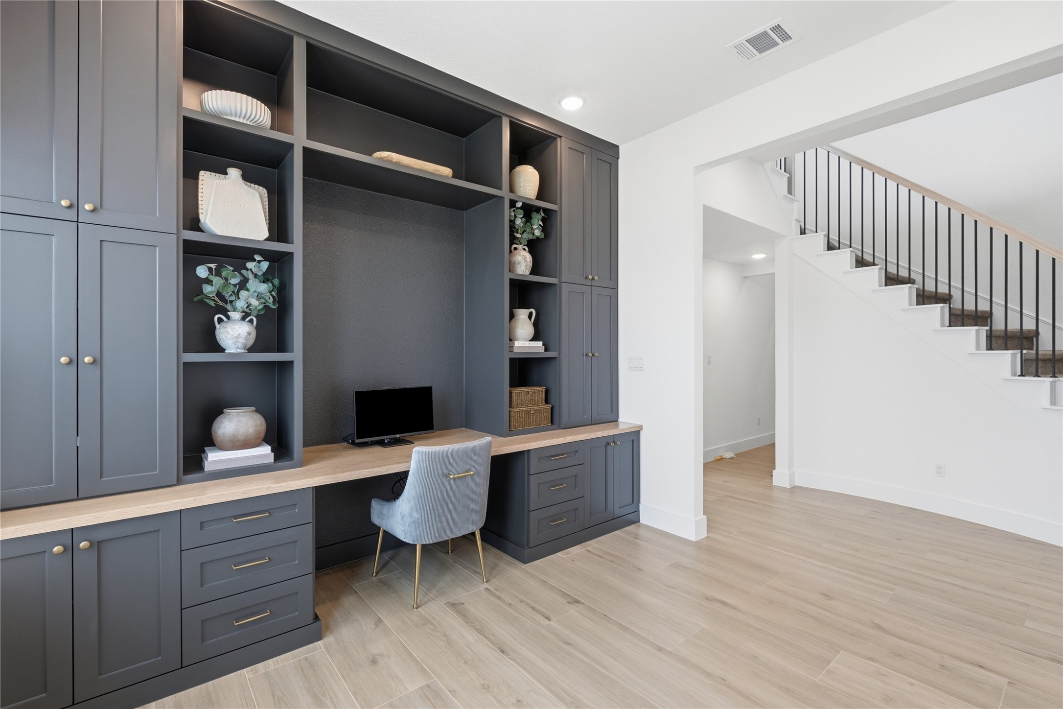 836 Villa Rialto View Leander, TX 78641 - Photo 20 of 33 A dedicated home office space with built-in cabinetry and ample storage offers a perfect work-from-home solution.
