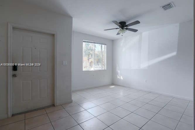 2911 Southeast 15th Road, Unit 65 Homestead, FL 33035 - Photo 2 of 11 a view of an empty room with a window