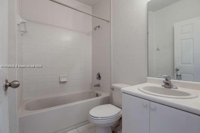 2911 Southeast 15th Road, Unit 65 Homestead, FL 33035 - Photo 10 of 11 a bathroom with a sink toilet and shower