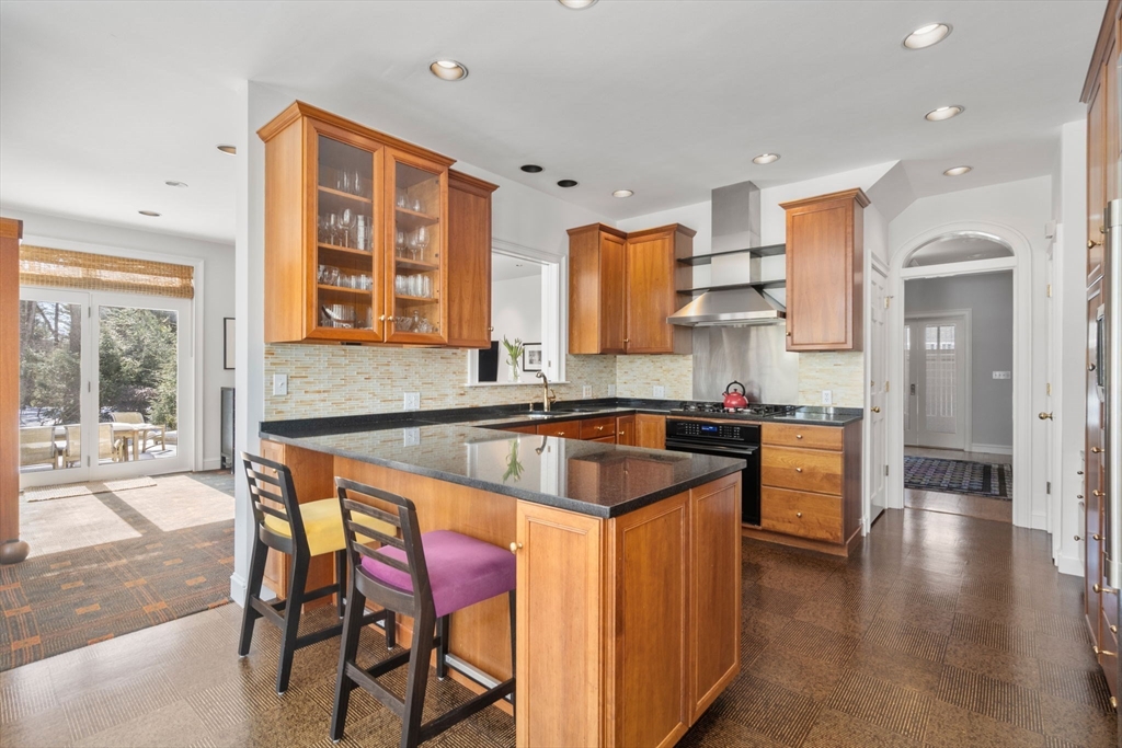 86 Whittier Road Wellesley, MA 02481 - Photo 13 of 39 a kitchen with granite countertop a sink and a refrigerator