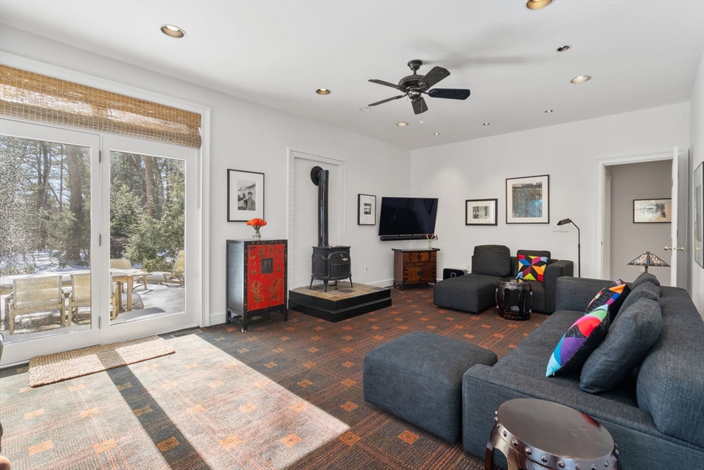 86 Whittier Road Wellesley, MA 02481 - Photo 14 of 39 a living room with furniture and a flat screen tv