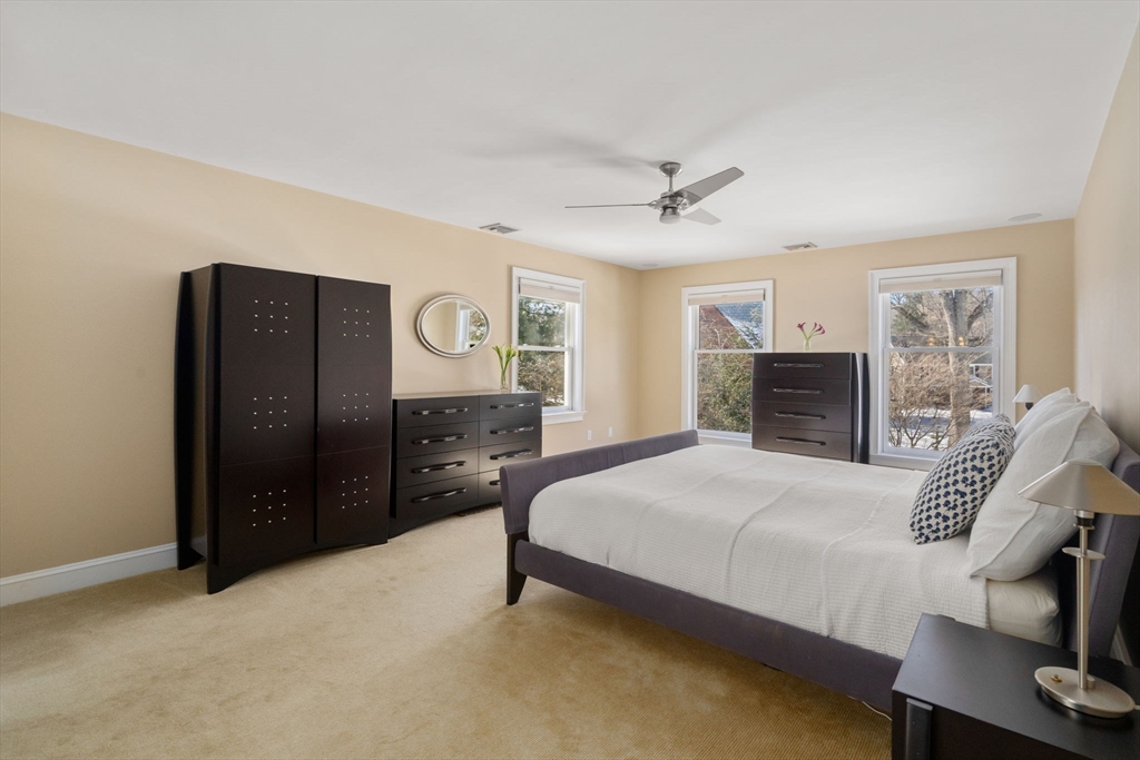86 Whittier Road Wellesley, MA 02481 - Photo 19 of 39 a bedroom with a bed and wooden floor