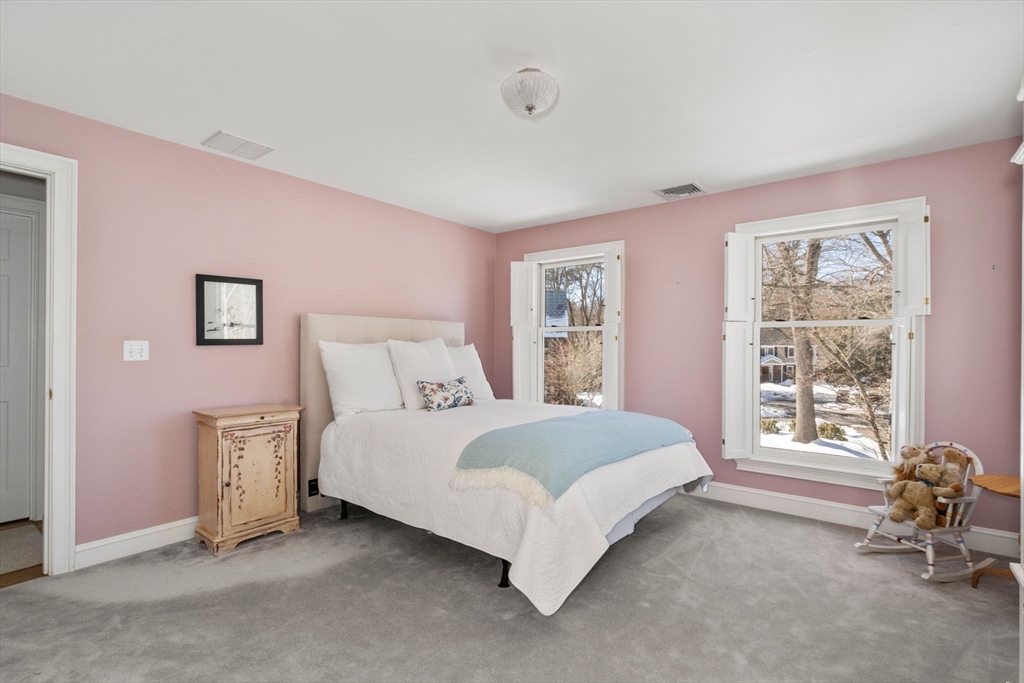 86 Whittier Road Wellesley, MA 02481 - Photo 24 of 39 a bed room with a bed and a chair