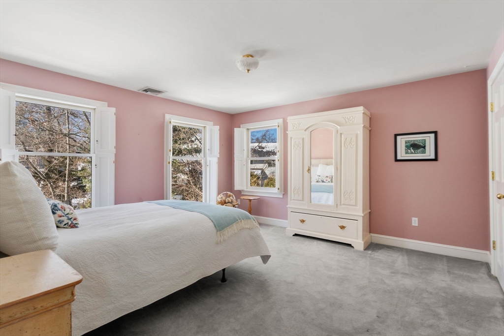 86 Whittier Road Wellesley, MA 02481 - Photo 25 of 39 a spacious bedroom with a large bed and wooden floor