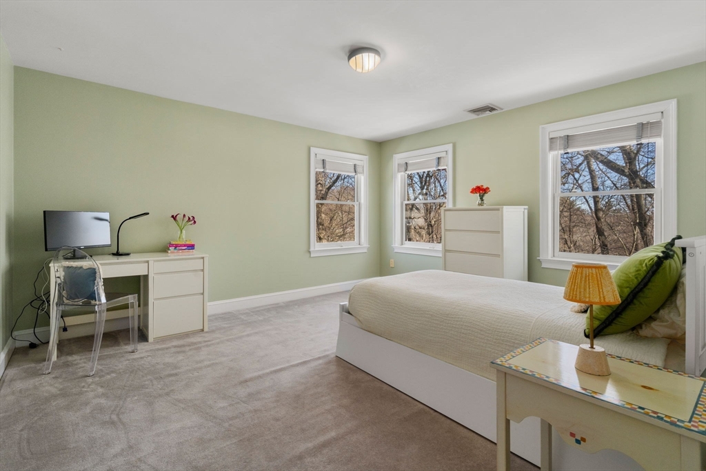 86 Whittier Road Wellesley, MA 02481 - Photo 27 of 39 a bedroom with a bed and furniture