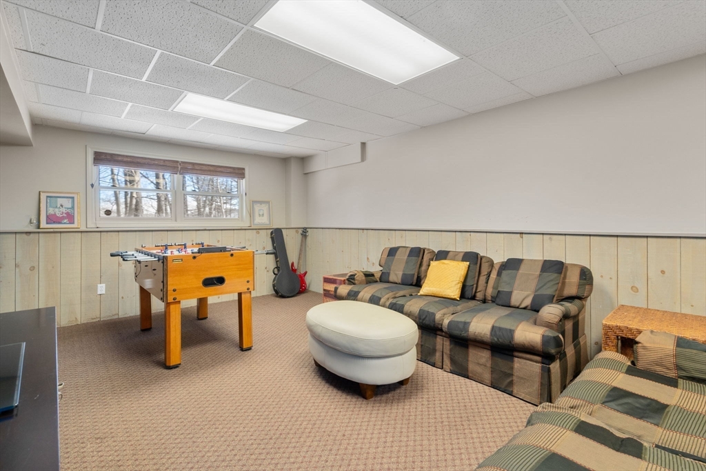 86 Whittier Road Wellesley, MA 02481 - Photo 31 of 39 a living room with furniture and a flat screen tv