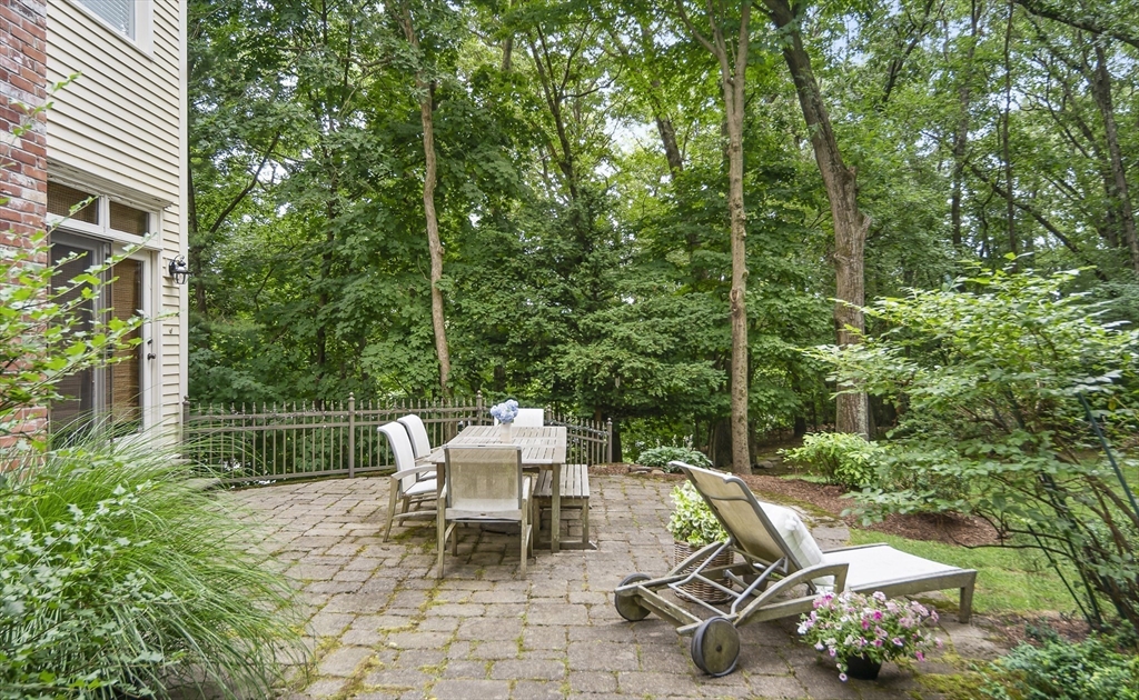 86 Whittier Road Wellesley, MA 02481 - Photo 35 of 39 a view of a chairs and table in backyard
