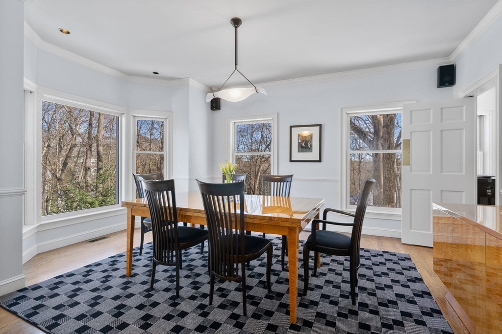 86 Whittier Road Wellesley, MA 02481 - Photo 7 of 39 a dining room with furniture a rug and wooden floor
