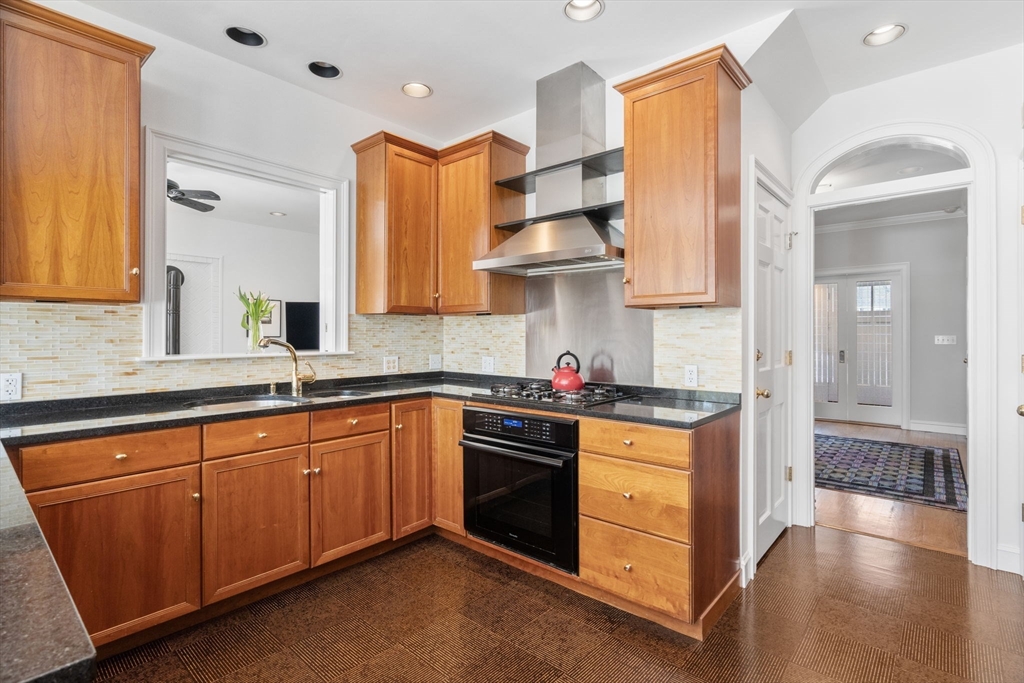86 Whittier Road Wellesley, MA 02481 - Photo 9 of 39 a kitchen with stainless steel appliances granite countertop a stove and a sink