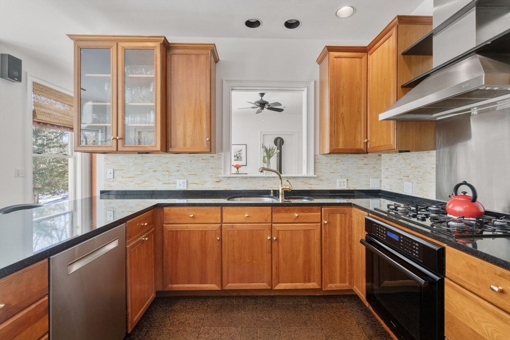 86 Whittier Road Wellesley, MA 02481 - Photo 10 of 39 a kitchen with granite countertop white cabinets and white appliances