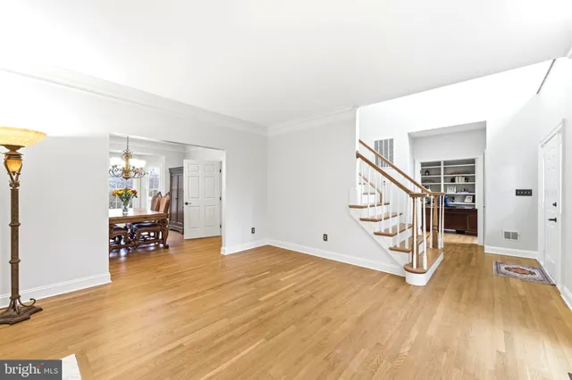 a bedroom with a bed window and dresser