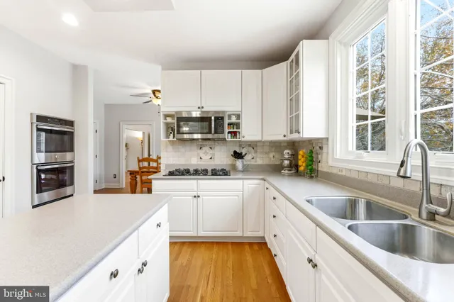 a view of a garden with a bench in the patio