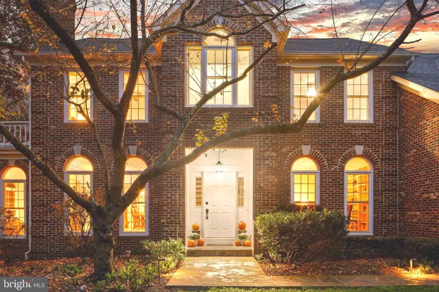 a kitchen with a sink appliances and cabinets