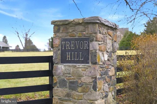 a kitchen with a sink appliances and cabinets