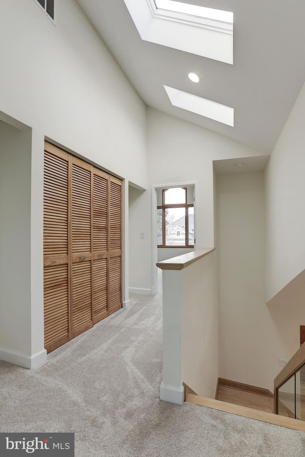 5826 Conway Road Bethesda, MD 20817 - Photo 14 of 30 Upper floor landing-washer and dryer in closet