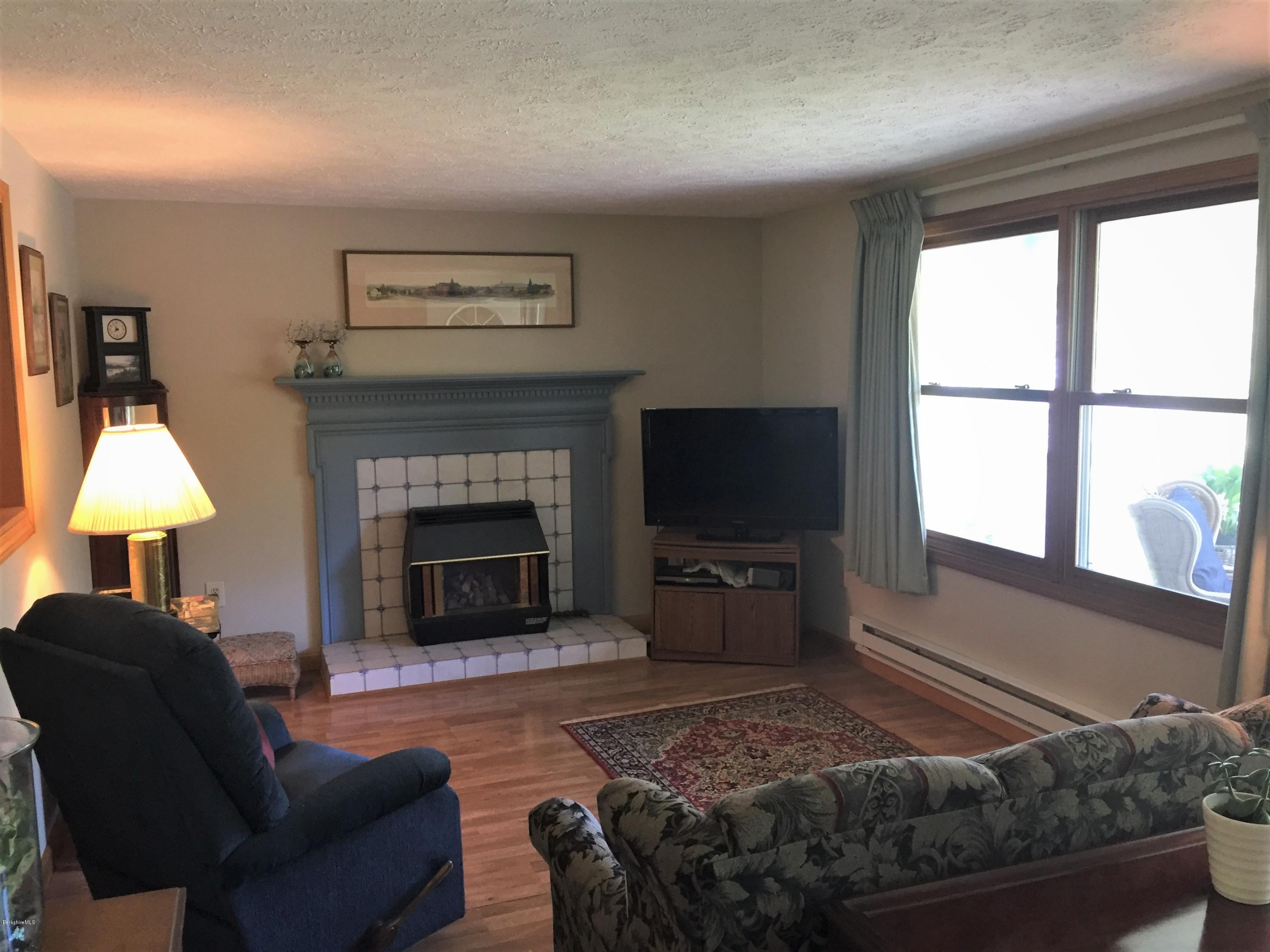 295 Mandalay Road Lee, MA 01238 - Photo 14 of 29 Living room and gas fireplace