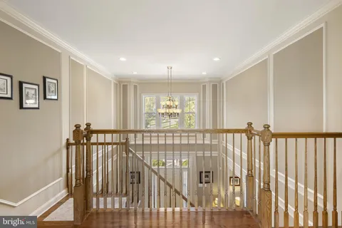 a bathroom with a tub a sink and mirrors