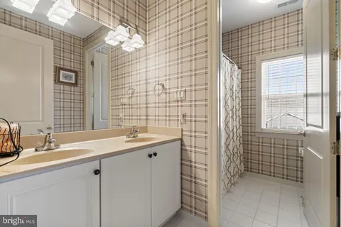 a bed room with a bed and a window