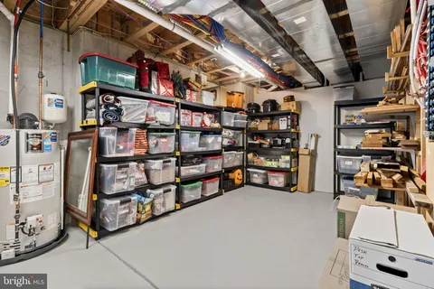 a view of a white house in front of a big yard