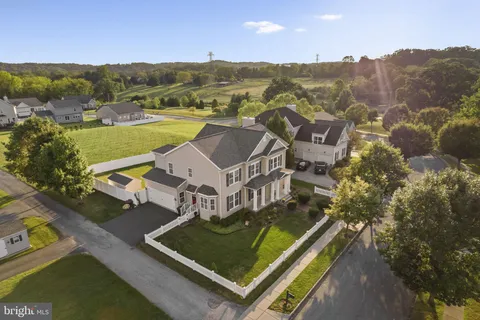 a front view of a residential apartment building with a yard