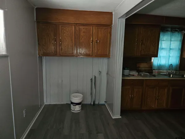 a kitchen with a refrigerator and a sink