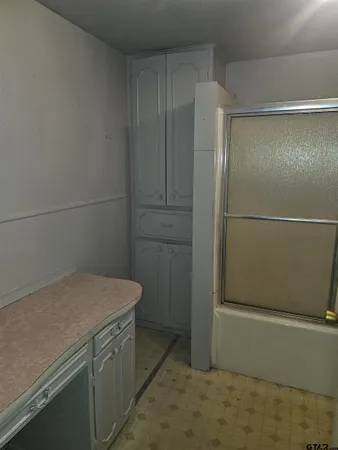 a kitchen with a refrigerator and countertop