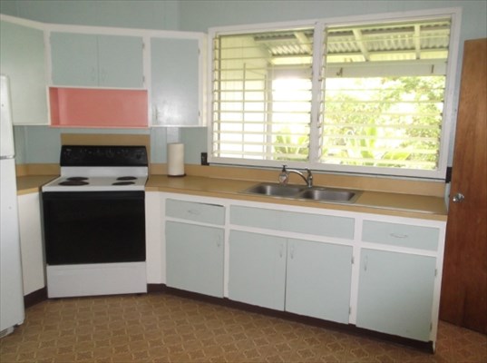 4971 Ea Road Kapaa, HI 96746 - Photo 11 of 25 a kitchen with a sink cabinets and a large window