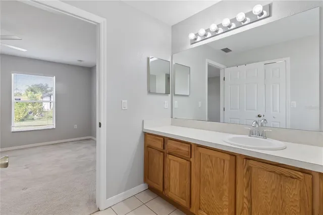 a bathroom with a sink double vanity and a mirror