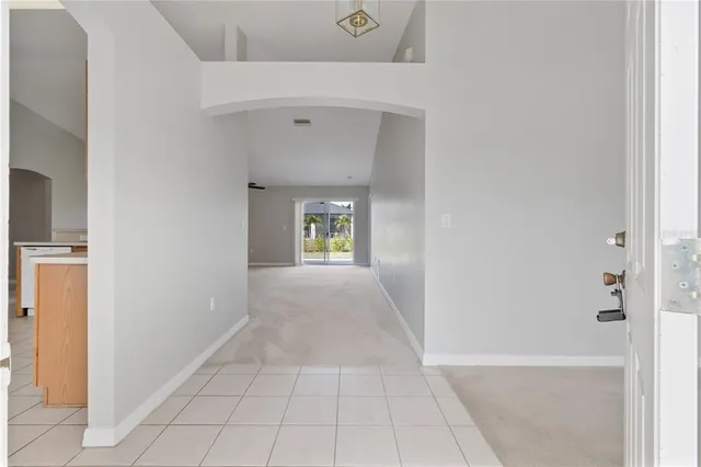 a view of an entryway with a hallway