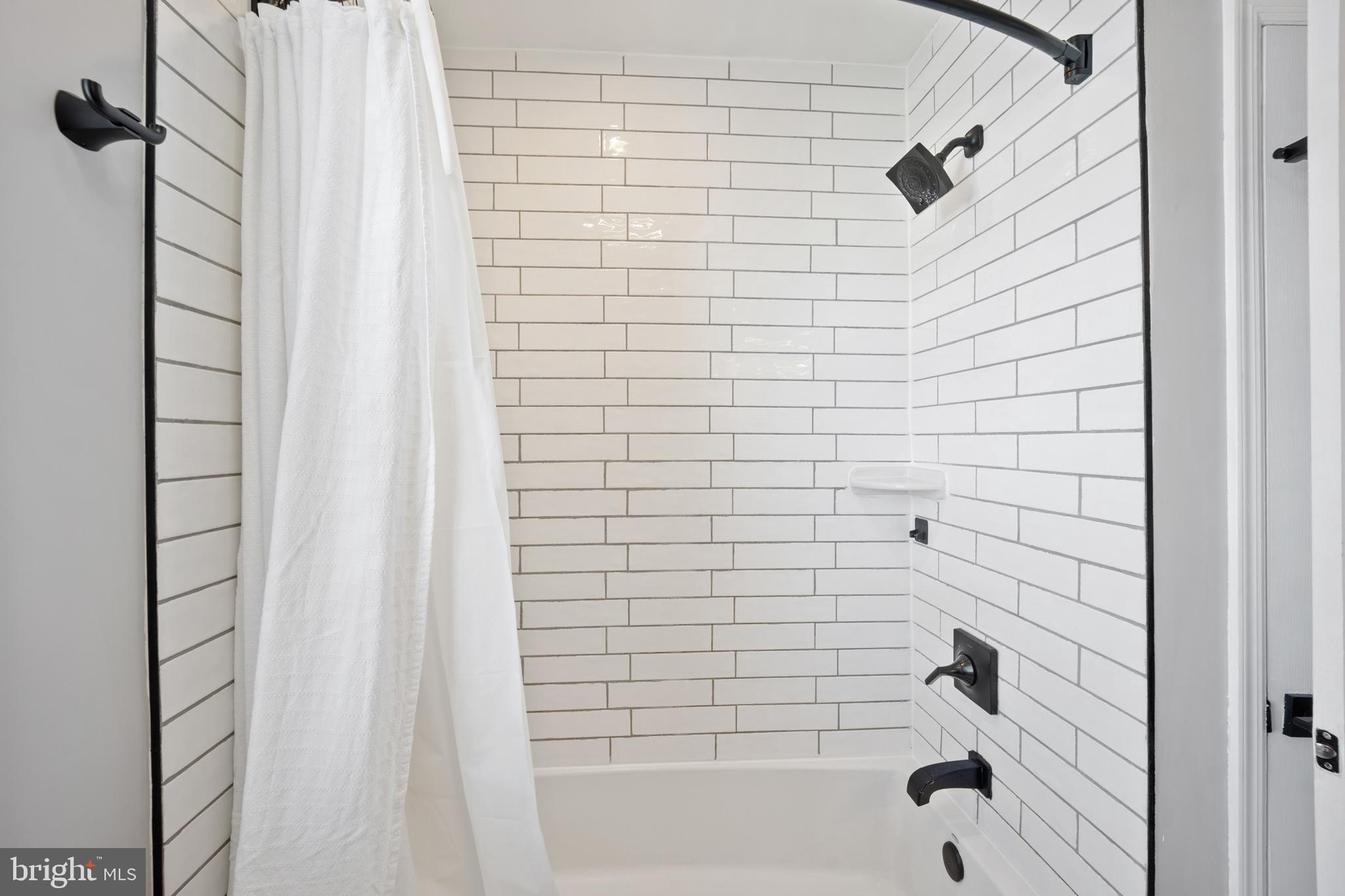 222 Lynbrooke Road Springfield, PA 19064 - Photo 27 of 42 Remodeled Hall Bathroom With Custom Subway Tile