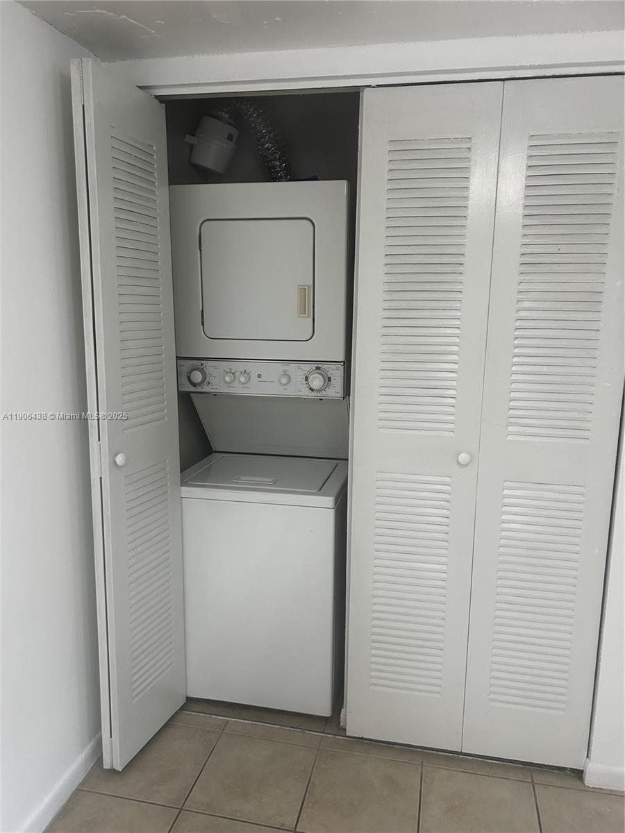 7110 Northwest 179th Street, Unit 110 Hialeah, FL 33015 - Photo 5 of 13 a utility room with a washer and dryer