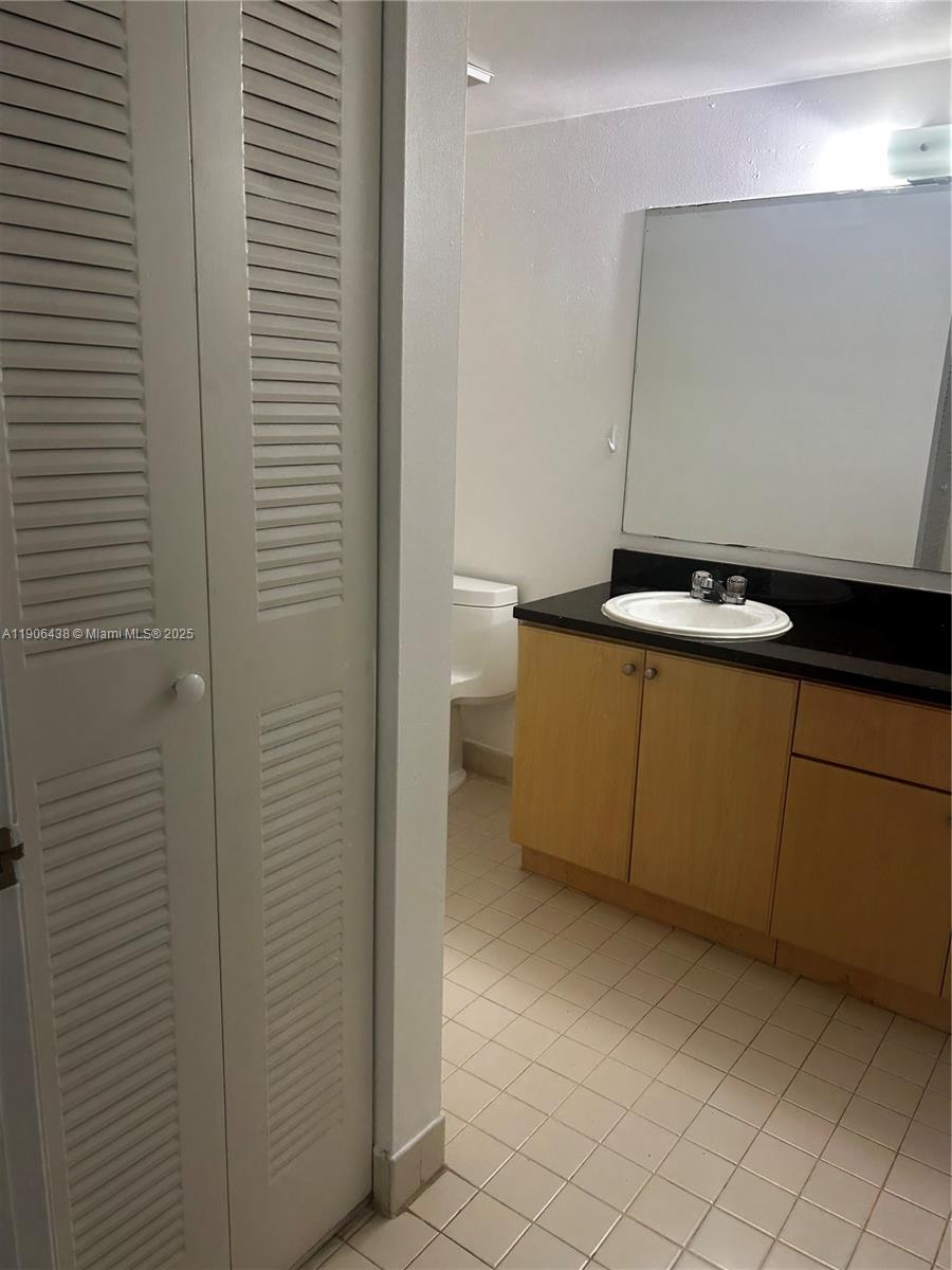 7110 Northwest 179th Street, Unit 110 Hialeah, FL 33015 - Photo 8 of 13 a view of a livingroom with washer and dryer