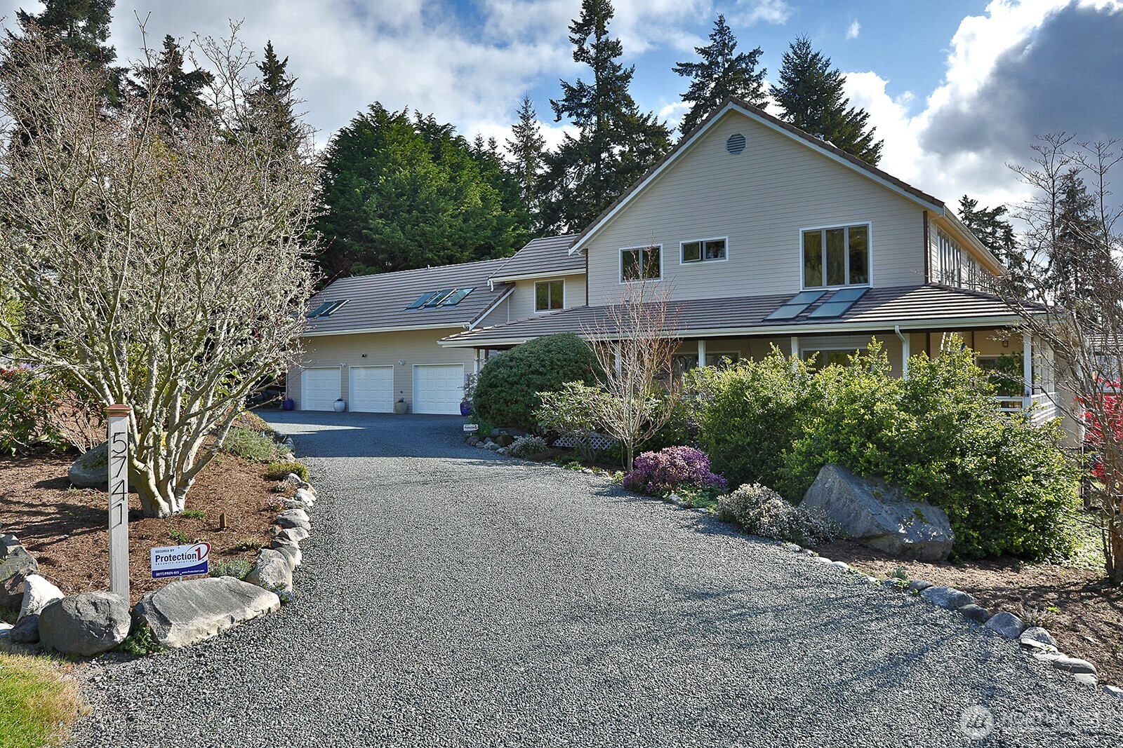 5741 Crow Haven Road Langley, WA 98260 - Photo 18 of 40 a front view of a house with a yard and potted plants