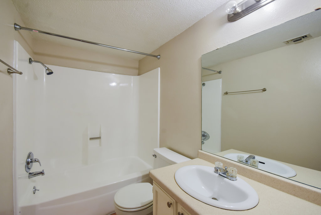 1000 West 26th Street, Unit 102 Austin, TX 78705 - Photo 18 of 23 a bathroom with a sink toilet and shower